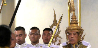 Newly crowned Thai king carried in spectacular procession