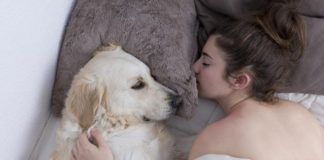 For women, sleeping next to a dog would be more beneficial than with a human being