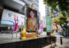 Thais give alms, wear purple to celebrate new queen’s birthday