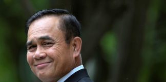 Thai junta leader orders end to army rule but keeps tough powers